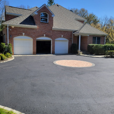 Newly completed residential driveway paving project in Palm Beach County by A-Top Paving (DBA Florida Paving Pros), demonstrating quality asphalt work with an impeccable finish.